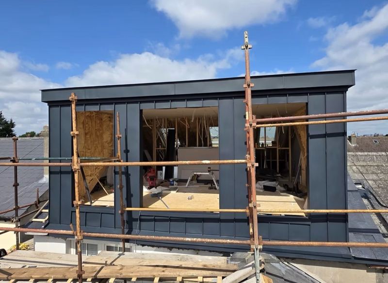 Zinc clad dormer on a concrete tile roof, showing the quality of DD Roofing work