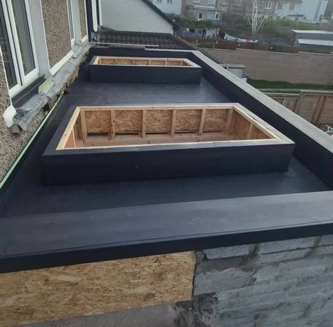 EPDM flat roof membrane installation with skylight openings