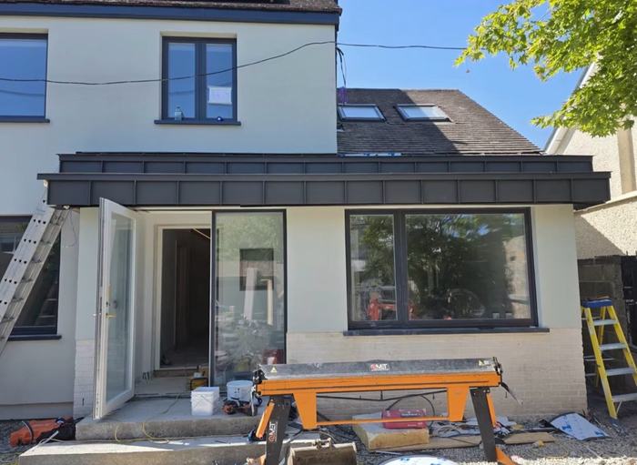 Completed zinc cladding dormer, front view with window openings
