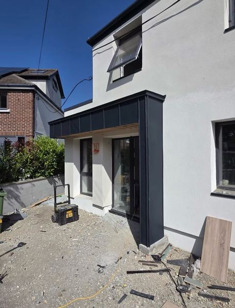 Rear extension with zinc standing seam cladding canopy